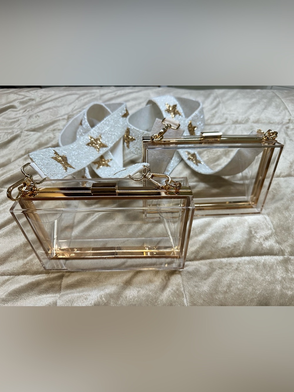 2 Clear Acrylic Clutches with Gold Trim and White Star Strap